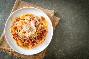 Homemade pasta fettuccine bolognese with cheese