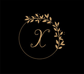 The logo has an elegant and classic design, with the main element being a monogram of the initials, such as the letters A and B, written using a calligraphy or serif font with fine details. The gold c
