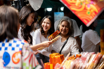 Family exploring for preparing to Celebrating Chinese New Year at Market