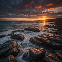 Fototapeta premium .A dramatic sunset over a rocky shoreline.