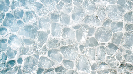 Clear blue water with bubbles and ripples creates serene atmosphere