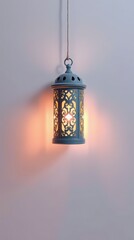 Arabic design shadow from lantern light on a plain background.
