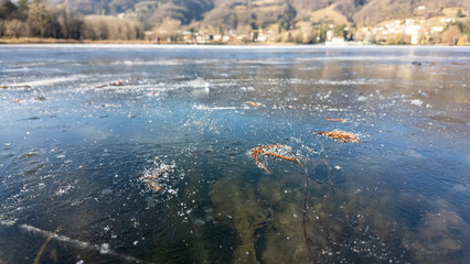 Endine lake, Bergamo, Italy. Amazing view of the frozen lake. Winter time. Ice covers the lake