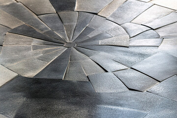 Delicate concrete tiles are laid in circular patterns. (Generative AI)