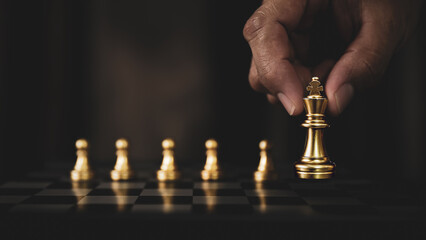 Hand choose king chess stands for leadership strategic planning and human resources or winner strategy or wining challenge of team player or business teamwork and organization management. © Jintana