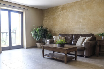 Cozy living room with natural light and indoor plants in a modern setting