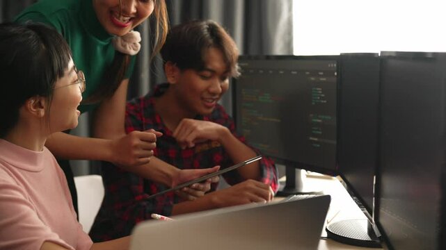 Back end software developer engineer for computer programming working together on debugging writing computing code, solving complex algorithms display on monitor in office. Burgeoning