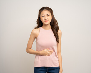 A woman had a stomach ache and gastritis. She put her hand on her stomach and squeezed it to relax and soothe. Unwell unhealthy female menstrual cramps on isolated white background.