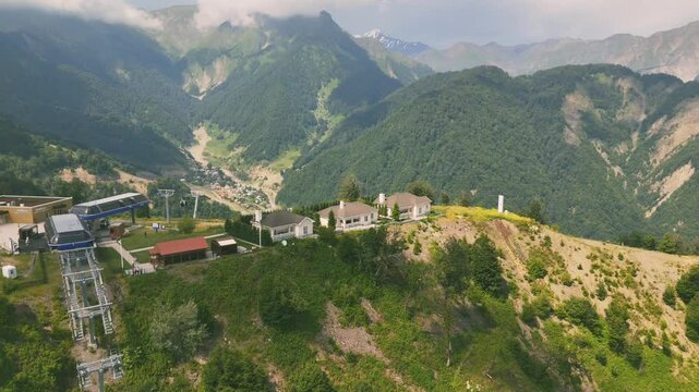 Drone footage exploring the landscape green mountains and rural houses of Gebele City in Azerbaijan