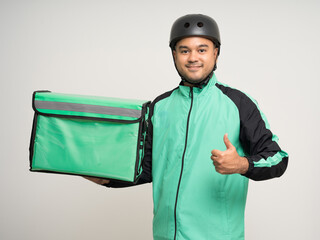 Young asian rider wearing green jacket uniform and bike helmet various action with delivery box. Male delivery service worker. Courier and shipping food service to customer online application