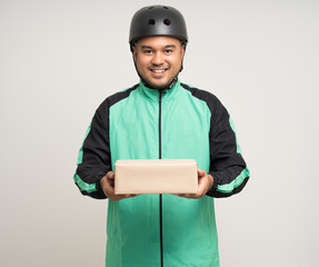 Young asian rider wearing green jacket uniform and bike helmet various action holding paper parcel box delivery to customer. Delivery man service worker Courier and shipping parcel cardboard service.