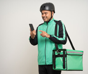 Young asian rider wearing green jacket uniform and bike helmet various action with delivery box. Male delivery service worker. Courier and shipping food service to customer online application