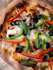 Homemade Sourdough pizza on Wooden Table.