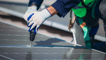 Worker installs solar panels on a rooftop during clear weather in a sustainable energy initiative