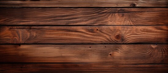 Naklejka premium Textured wooden background with rich brown tones and natural grain patterns, positioned horizontally to create a rustic, warm atmosphere.