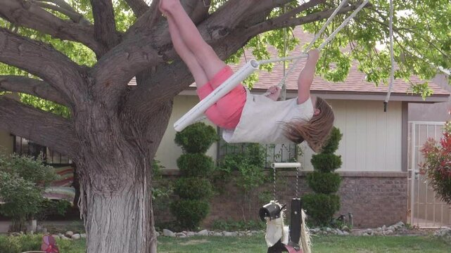 Slow Motion Gril Swinging on Tree Swing