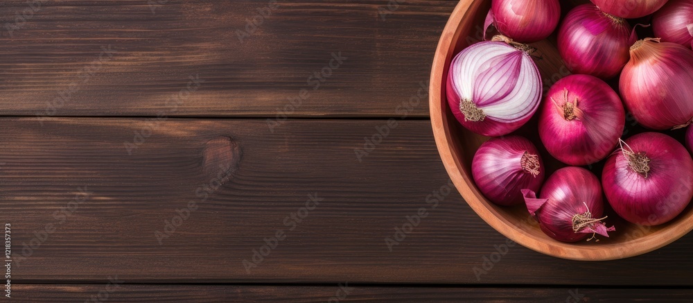 Poster Basket of whole and cut red onions atop a rustic wooden background with deep brown hues creating ample copy space on the left side of the image