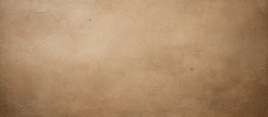 Obraz premium Textured kraft paper background in shades of gray and beige with ample copy space for design elements or text placement in mockup layout.