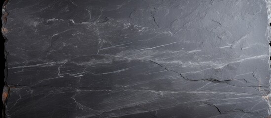 Gray slate texture featuring subtle white veins, ample empty space for text or images, with a clean, minimalist appearance suitable for design projects.