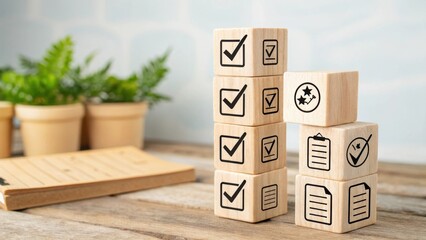 A stack of wooden blocks with checkmarks and icons, symbolizing organization and task management, placed beside small potted plants on a wooden surface.