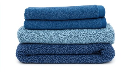 A stack of folded denim in various shades of blue on a clean white background.