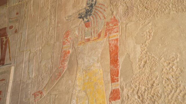Ancient Egyptian wall paintings of Anubis in the Temple of Hatshepsut