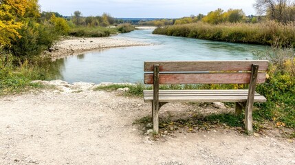 Obraz premium Serene River View with Wooden Bench in Autumn