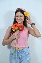 portrait of a woman with flowers. girl with gerbera flowers. smile and flowers. happy woman with flowers. greeting card,