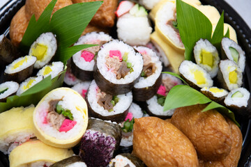Close up of assorted okazuya sushi on Japanese deli platter