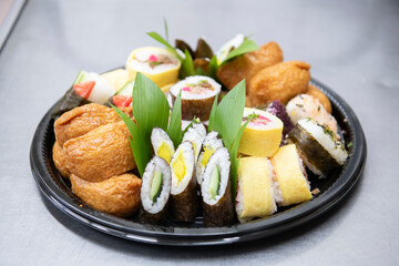 Assorted okazuya sushi platter in Japanese deli