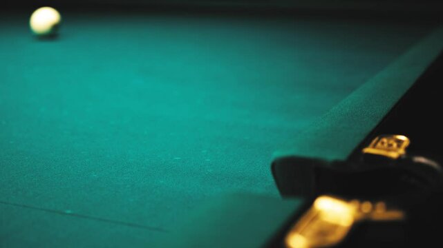 The ball, after colliding with another ball, spins and falls perfectly into the pocket.