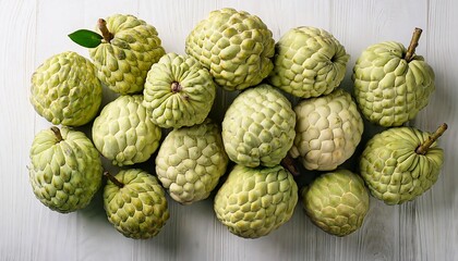 Obraz premium Flat Lay Top View of Bright Ripe Fragrant White Sugar apple Fruit as Background