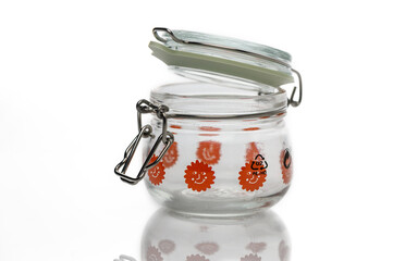 Colorful glass jar with floral design and a metal clasp for storage and display purposes