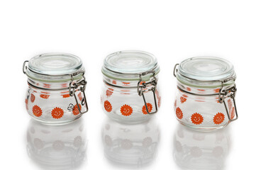 Colorful glass jars with decorative lids perfect for kitchen storage and organization