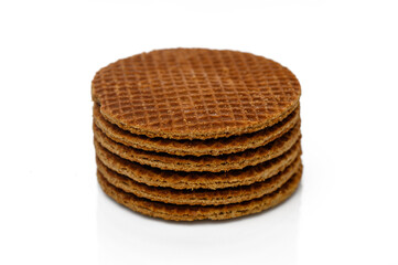 Crunchy waffle cookies stacked on a white background ready for a delicious snack or dessert
