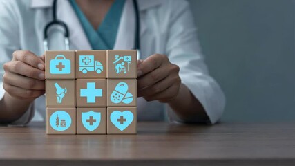 Doctor builds blocks with health and medical icons symbolizing creation of online healthcare platform, digital healthcare network and first healthcare insurance innovation