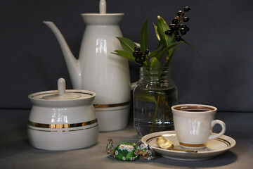 White porcelain coffee set. Morning coffee with candy.