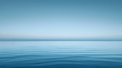Obraz premium Serene ocean landscape; calm water meeting tranquil sky. Perfect for meditation, relaxation, and travel themes.