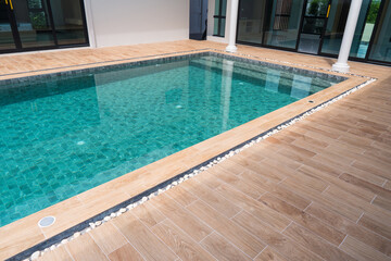 Luxury Modern Home Poolside Teal Water Wooden Deck Pebble Border