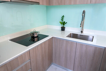 Modern Kitchen Interior Design White Countertop Wood Cabinets Stainless Steel Sink