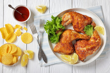 baked in oven three chicken leg quarters, top view