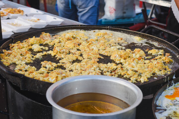A person is cooking a dish called 