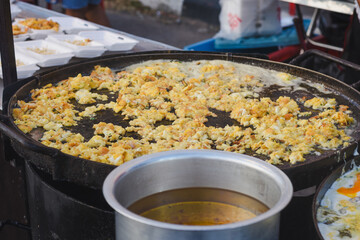 A person is cooking a dish called 