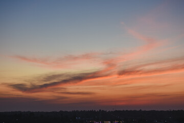 warm-toned orange sky during sunset. The sun is low on the horizon, casting a beautiful and calming glow across the sky.