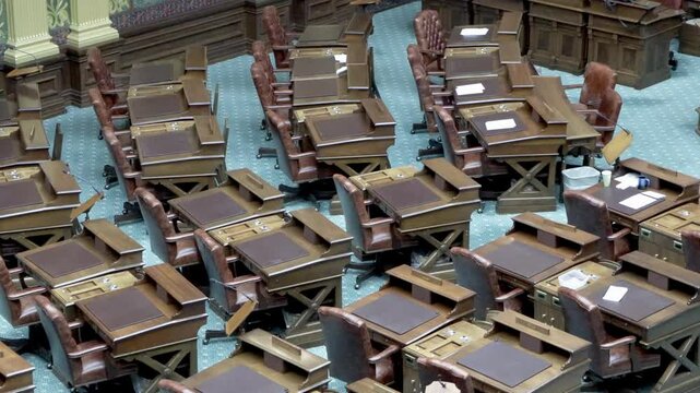 Michigan House of Representatives chamber desks inside the Michigan state capitol with stable close up video.