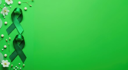 Green ribbons and flowers on green background, symbolizing mental health awareness