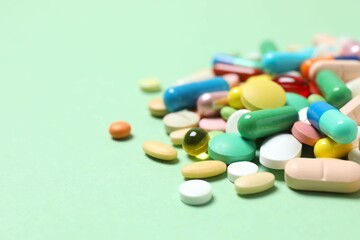 Various pills on color background