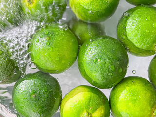 green tangerine in water