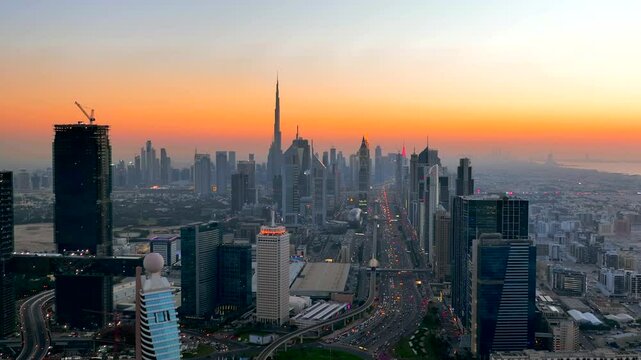 Sunset aerial view of Dubai's futuristic urban skyline
