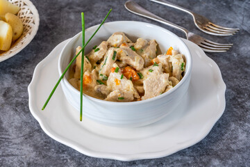 Pork in creamy mushroom sauce with boiled baby potatoes